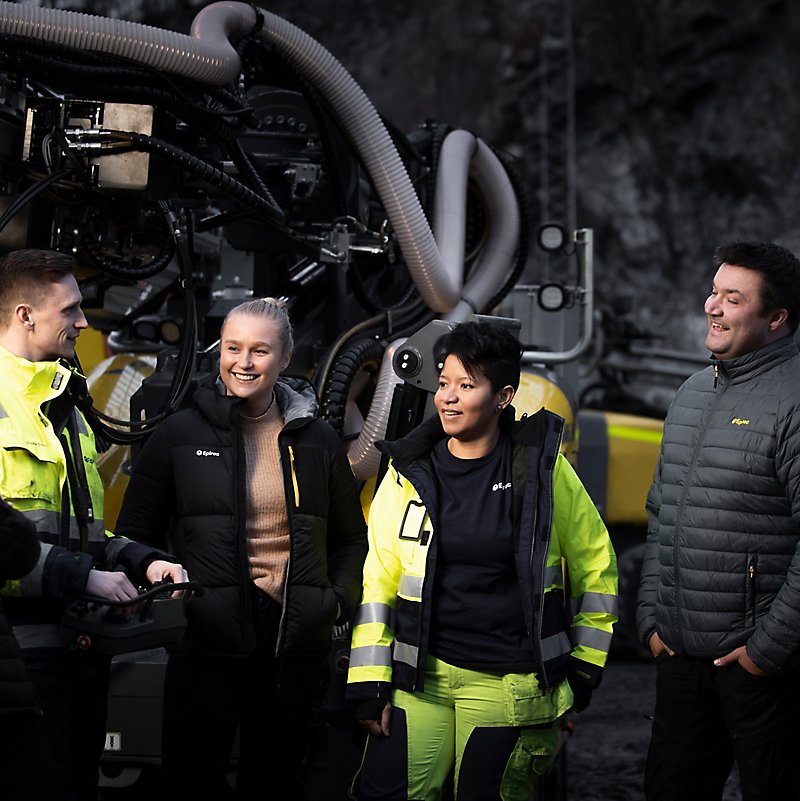 Epiroc team with machine in background